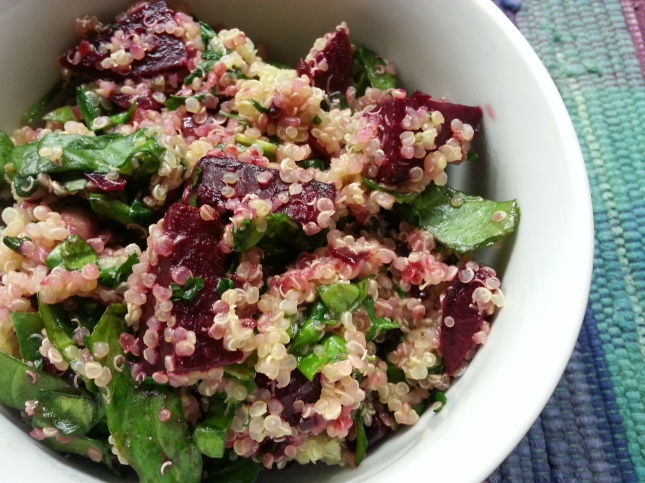 Beet and quinoa salad with wilted spinach