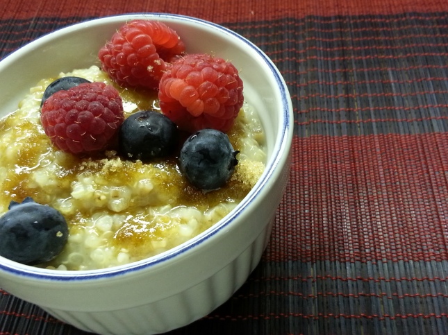Quinoa Oatmeal in bowl with fruit and brown sugar